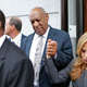 Left to right: Brian McGonagle, Bill Cosby, Angela Agrusa (Photo: EDUARDO MUNOZ ALVAREZ/AFP/Getty Images)